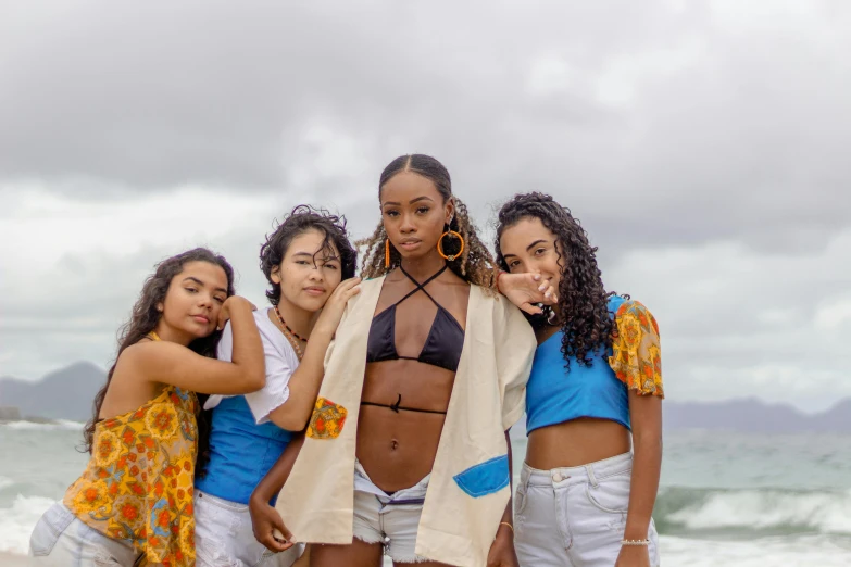 a group of women standing next to each other on a beach, by Lily Delissa Joseph, trending on pexels, afrofuturism, black teenage girl, sweet looks, hawaii, avatar image