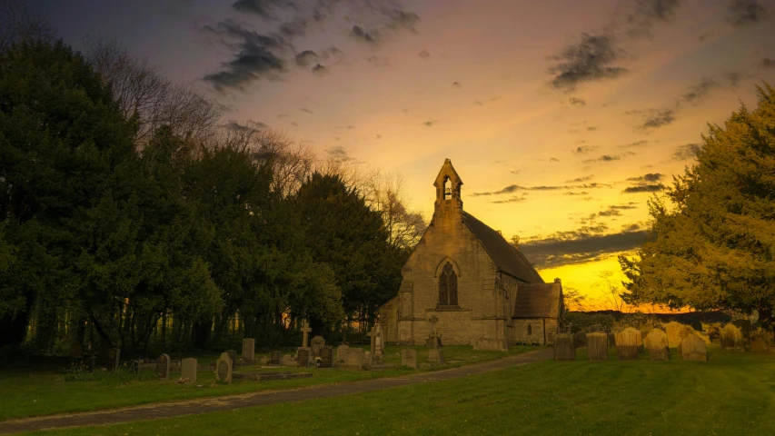 a church sitting on top of a lush green field, by Kev Walker, pexels contest winner, golden hour dusk sky, gravestones, brown, quaint