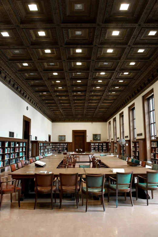 a room filled with lots of tables and chairs, arts and crafts movement, infinite celestial library, ceiling fluorescent lighting, full room view, recessed