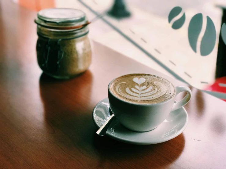 a cup of coffee sitting on top of a wooden table, trending on unsplash, brown and cream color scheme, multiple stories, thumbnail, the window is open