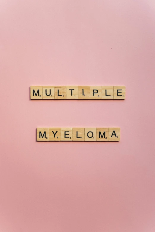 scrabbles spelling multiple myeloma on a pink background, by Mym Tuma, trending on pexels, 2 5 6 x 2 5 6, sycamore, mewtwo, velma