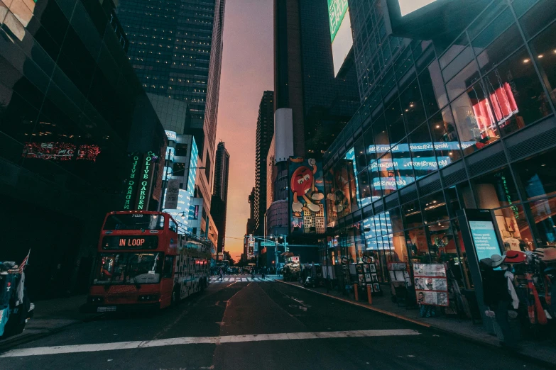 a city street filled with lots of tall buildings, pexels contest winner, dark city bus stop, time square, youtube thumbnail, golden hour photo