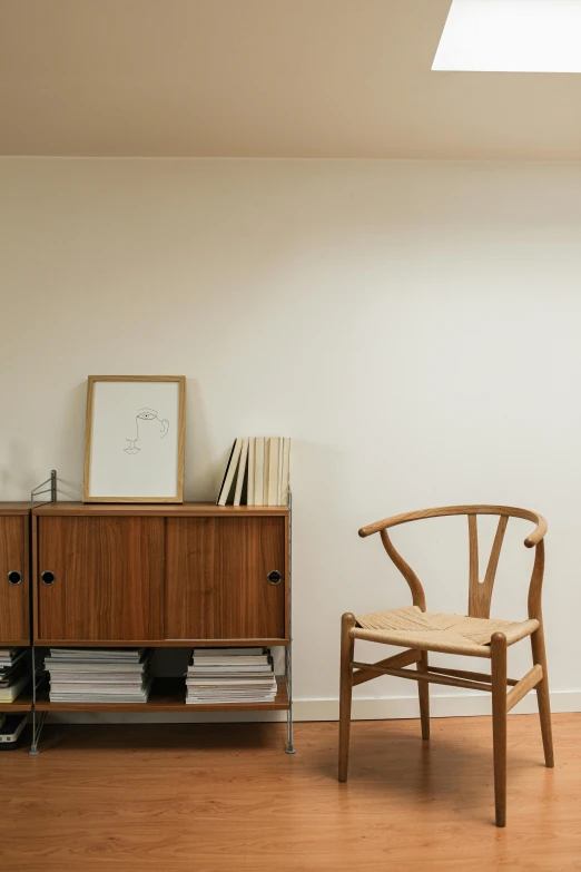 a living room filled with furniture and a skylight, inspired by Constantin Hansen, unsplash, minimalism, wooden cabinet, chair, basement, album