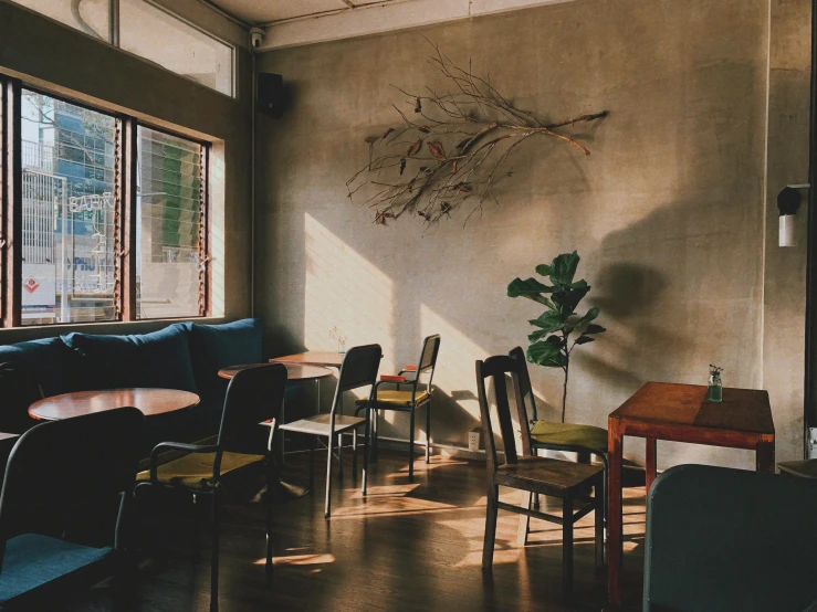 a living room filled with furniture next to a window, by Carey Morris, trending on unsplash, light and space, cafe tables, sasai ukon masanao, “ iron bark, closed limbo room