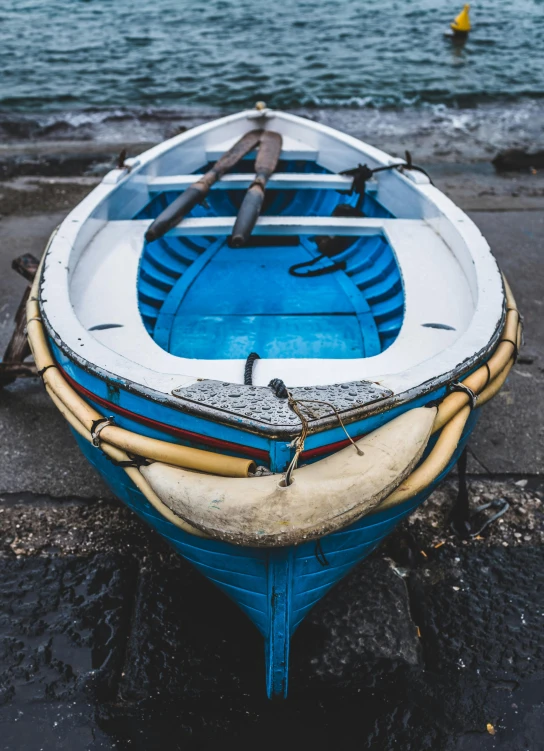 a blue and white boat sitting on top of a beach, pexels contest winner, dramatic details, ready to model, grey, painted
