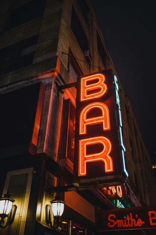 a neon sign on the side of a building, unsplash, sitting at the bar, brown, thumbnail, minn