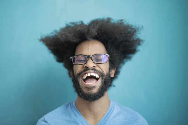 a close up of a person with a beard and glasses, an album cover, by Washington Allston, pexels contest winner, funk art, laughing hysterically, natural hair, 15081959 21121991 01012000 4k, flipped out hair