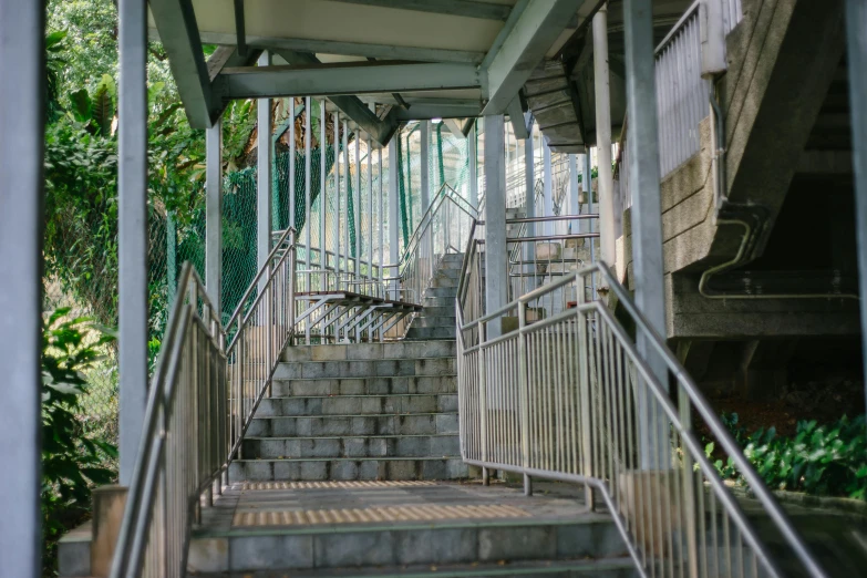 a set of stairs leading up to a building, sydney park, monorail station, fan favorite, under bridge