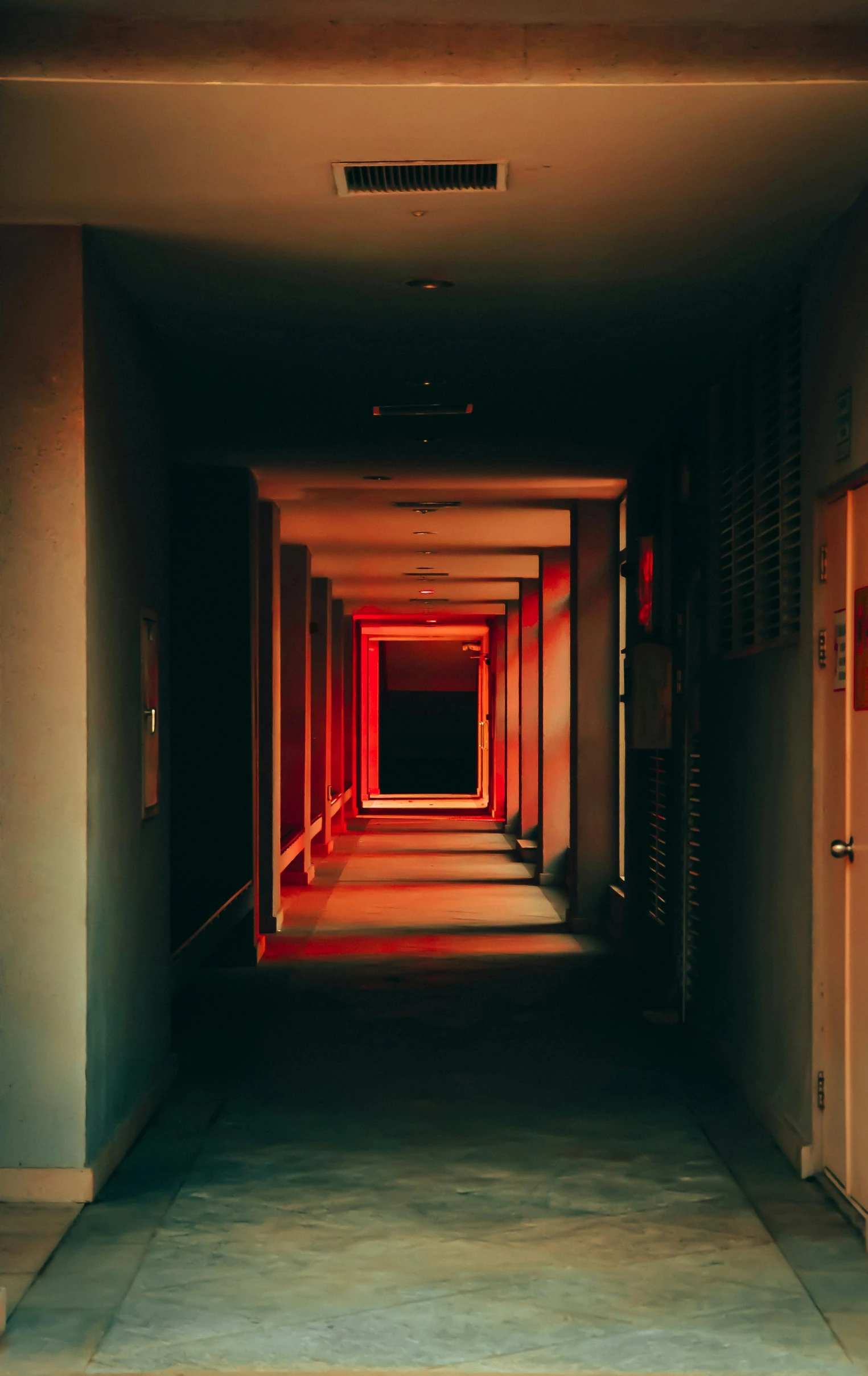 a long hallway with a red light at the end, an album cover, pexels contest winner, light and space, dark building, reds, instagram picture, convoluted halls