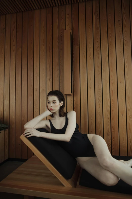 a woman sitting on a chair in a room, swim suite, with pale skin, gemma chen, smooth panelling