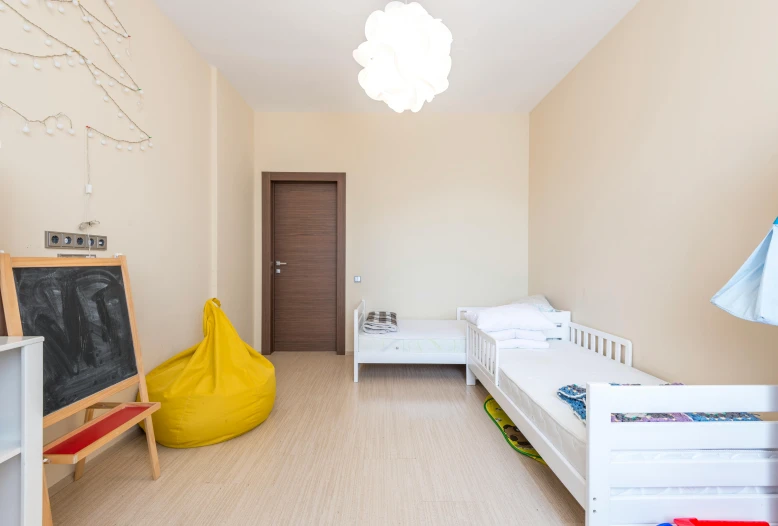 the children's room is clean and ready for us to use, a photo, by Alexander Fedosav, unsplash, superflat, some sandy yellow pillows, located in hajibektash complex, profile image, flat!!