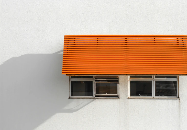 a fire hydrant in front of a white building, a minimalist painting, inspired by Christo, pexels contest winner, awnings, orange roof, space seen outside from a window, trending on dezeen