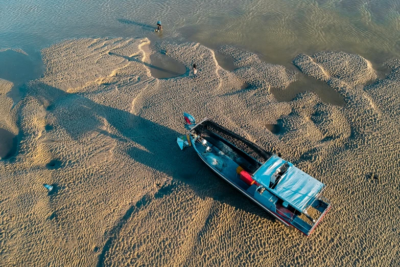 a boat sitting on top of a sandy beach, by Jan Tengnagel, pexels contest winner, river delta, a high angle shot, thumbnail, cinematic still