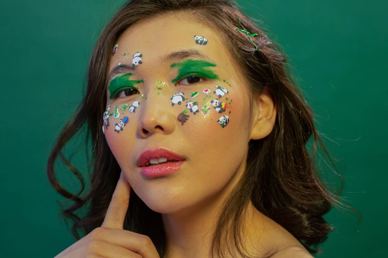 a close up of a woman with glitter on her face, an album cover, by Julia Pishtar, trending on pexels, young cute wan asian face, wearing green, decora inspired, full body image