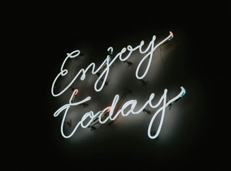 a neon sign that says enjoy today, by Emma Andijewska, instagram post, black, promo image, without text