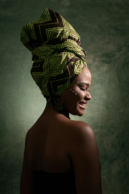 a woman with a turban on her head, by Chinwe Chukwuogo-Roy, shutterstock contest winner, afrofuturism, green and brown tones, bathed in light, beauty retouch, embracing