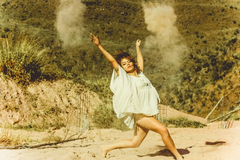 a woman in a white dress playing with a frisbee, an album cover, pexels contest winner, figuration libre, covered in dirt, wearing desert poncho, doing a sassy pose, vintage photo