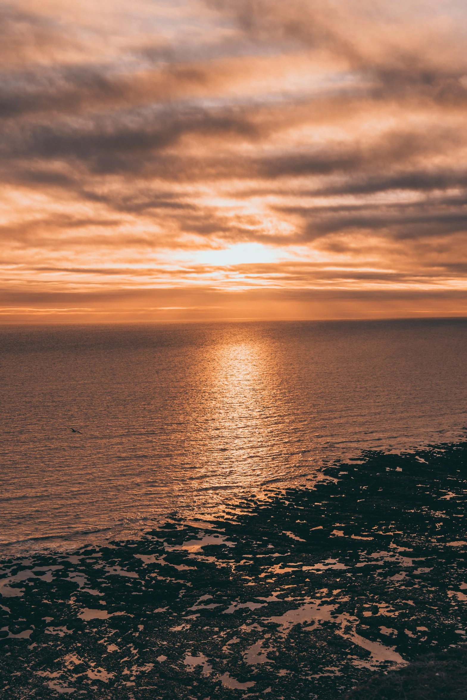 the sun is setting over a body of water, by Thomas Furlong, pexels contest winner, view from above on seascape, maryport, high quality photo, today\'s featured photograph 4k