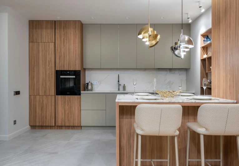 the kitchen is clean and ready for us to use, pexels contest winner, light and space, taupe, high quality photo, gold, polished concrete