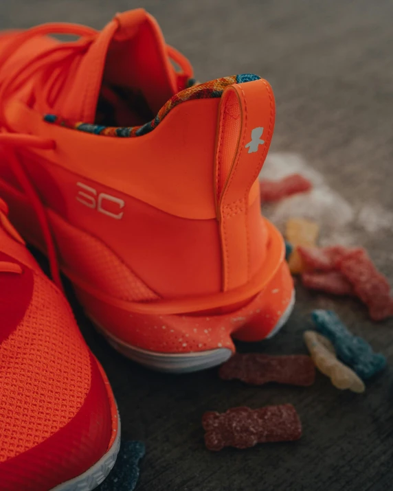 a pair of orange shoes with gummy gummy gummy gummy gummy gummy gummy gummy gummy gummy gummy, a picture, inspired by Paul Georges, trending on dribble, detail shot, 3 / 4 wide shot, gearing up for battle, thumbnail