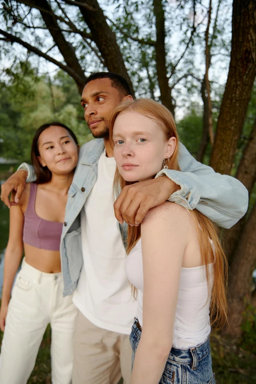 a group of young people standing next to each other, trending on pexels, renaissance, lean man with light tan skin, on a tree, two models in the frame, wearing a crop top