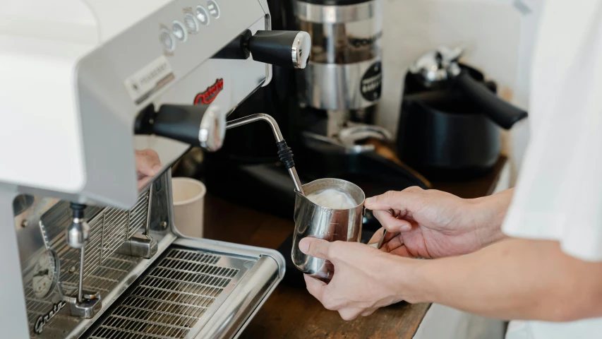 a close up of a person using a coffee machine, profile image, pearl silverplate, thumbnail, aussie baristas