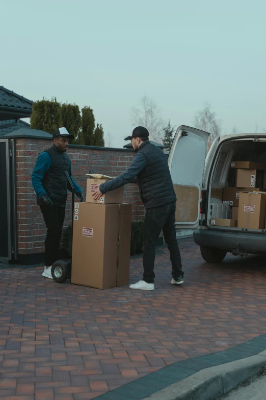 two men unloading boxes into a van, pexels contest winner, realism, low quality photo, video footage, 🚀🌈🤩, behaelterverfolgung