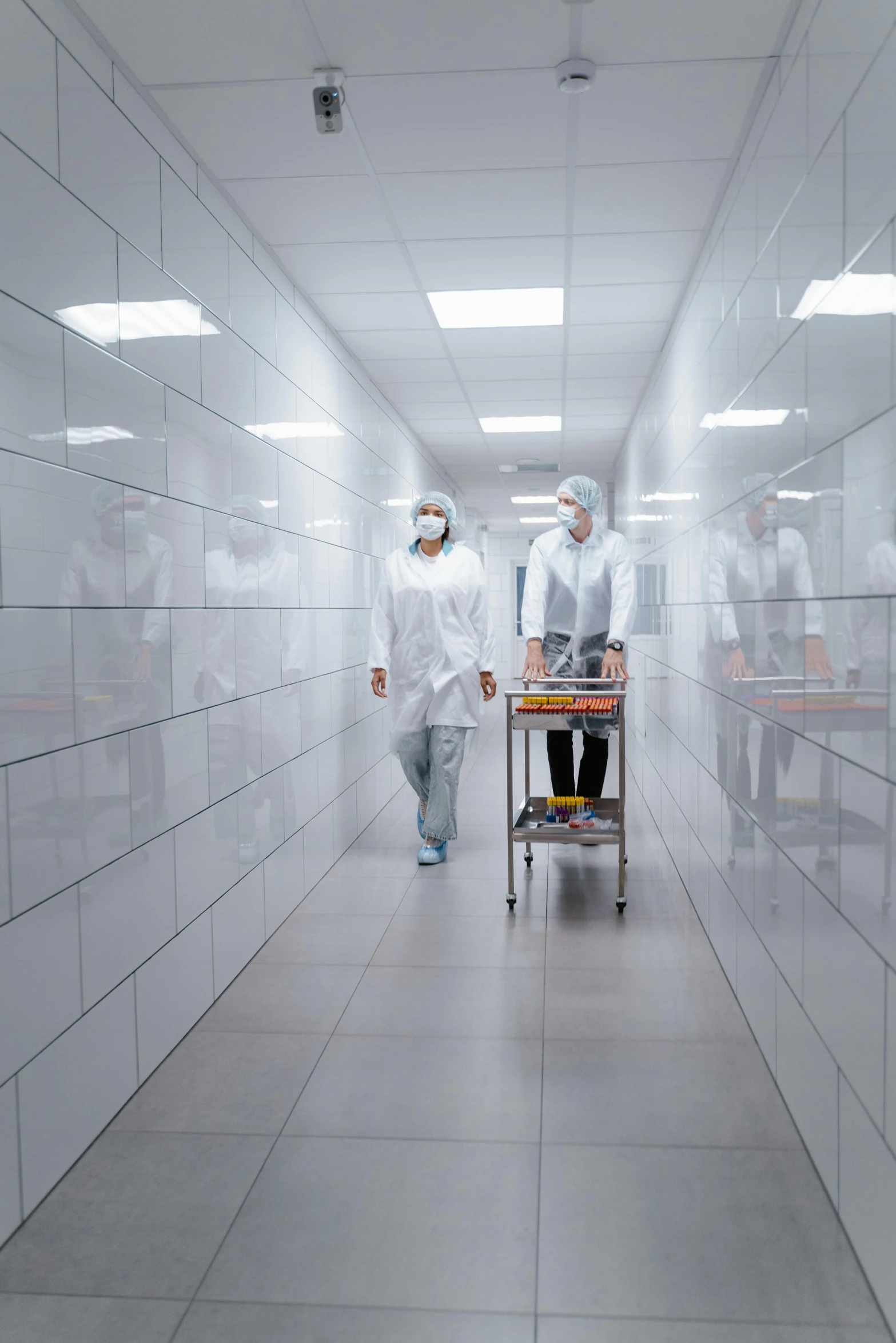 a group of people walking down a hallway, shutterstock, surgical implements, clean room, gif, high detal