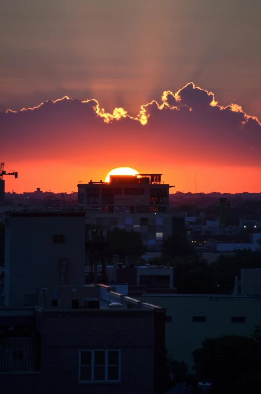 the sun is setting over the city skyline, a photo, by Joe Stefanelli, happening, puerto rico, new mexico, high quality image, fujifilm”