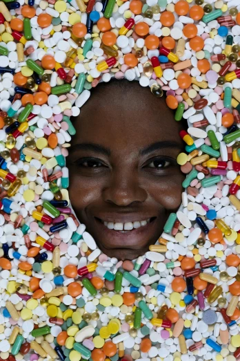 a close up of a person wearing a wreath of pills, by Arabella Rankin, aida muluneh, scientific photo, multicolored faces, advertising photo