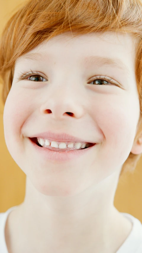 a close up of a child with a toothbrush, inspired by Robert Childress, brunette boy and redhead boy, smooth symmetrical chin, light smiling, thumbnail