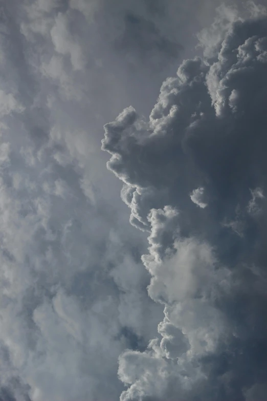 a jetliner flying through a cloudy sky, a picture, unsplash, cloud in the shape of a dragon, tumultuous, “puffy cloudscape, upclose