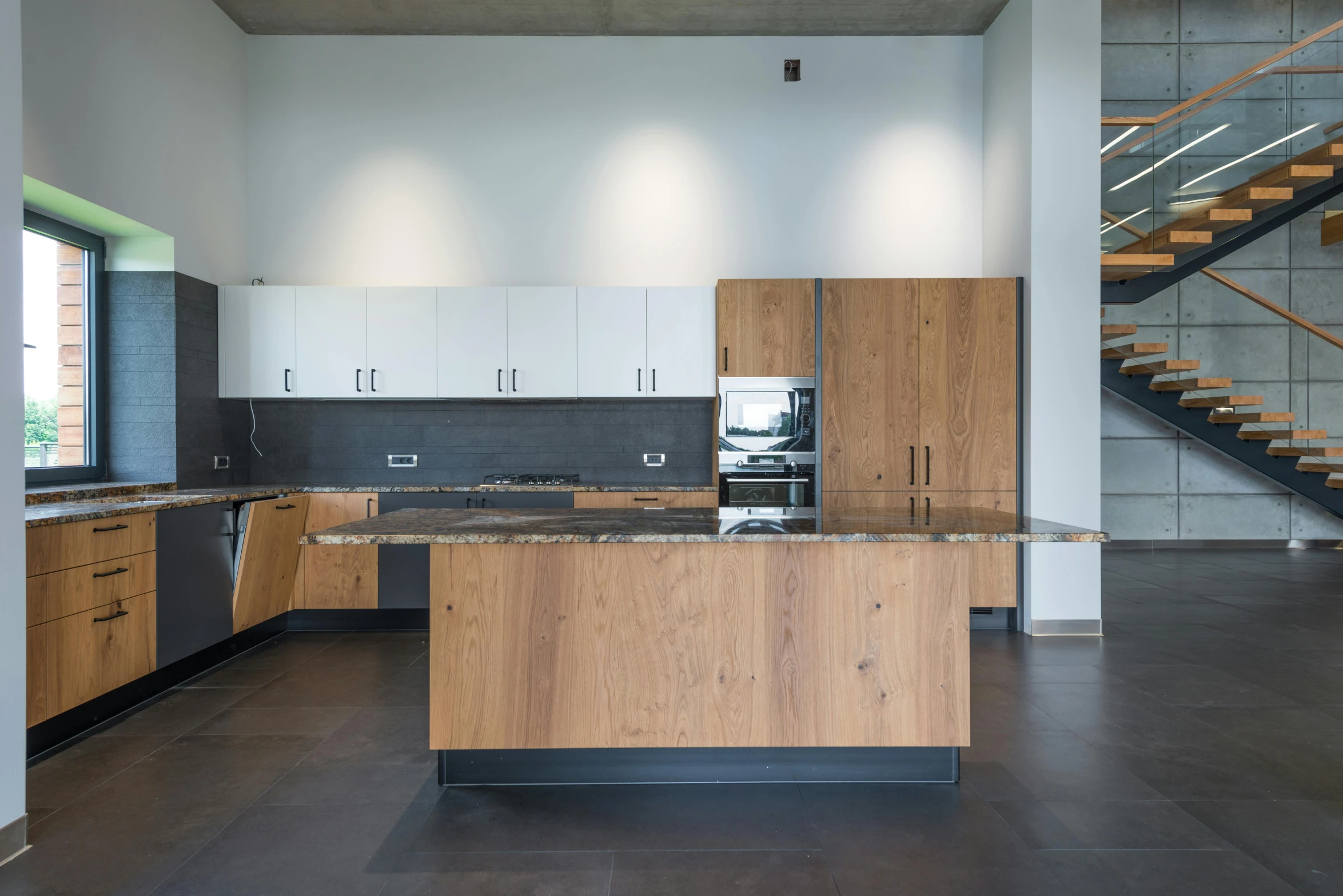 the kitchen is clean and ready for us to use, inspired by Heinrich Bichler, unsplash, modernism, in a open-space working space, blake stone, oak, central hub