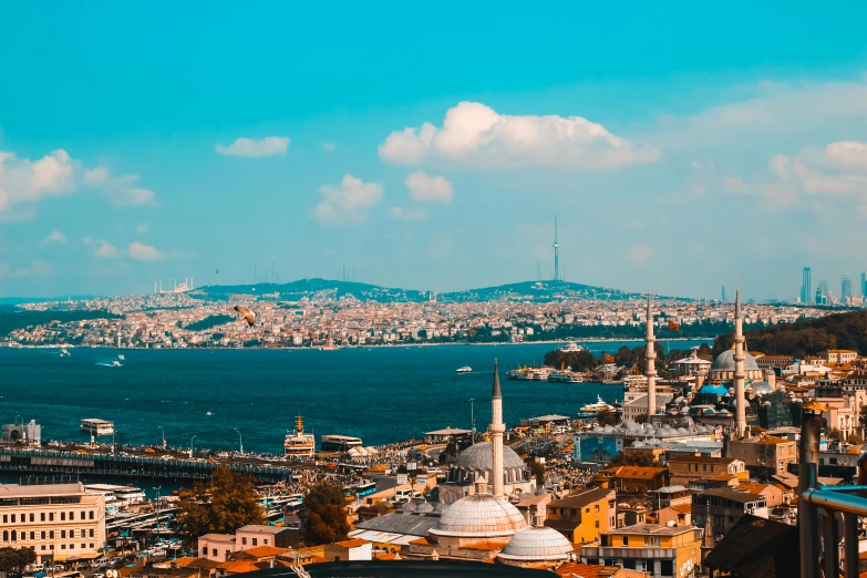 a view of a city from the top of a hill, a colorized photo, pexels contest winner, hurufiyya, turquoise water, brown, byzantine, background image