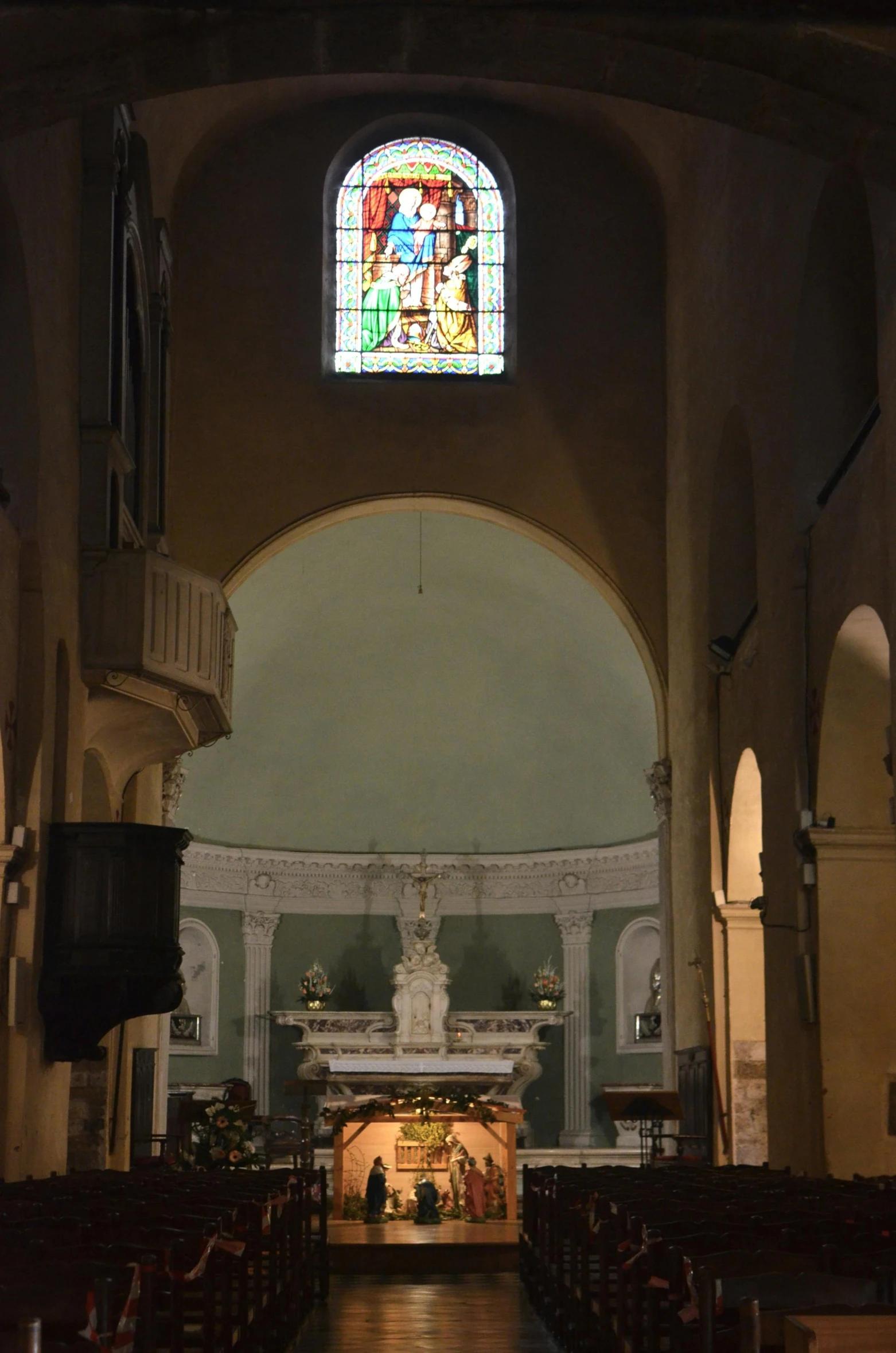 the inside of a church with a stained glass window, a picture, by Cagnaccio di San Pietro, lights inside, bust view, seen from a distance, taken in the late 2010s