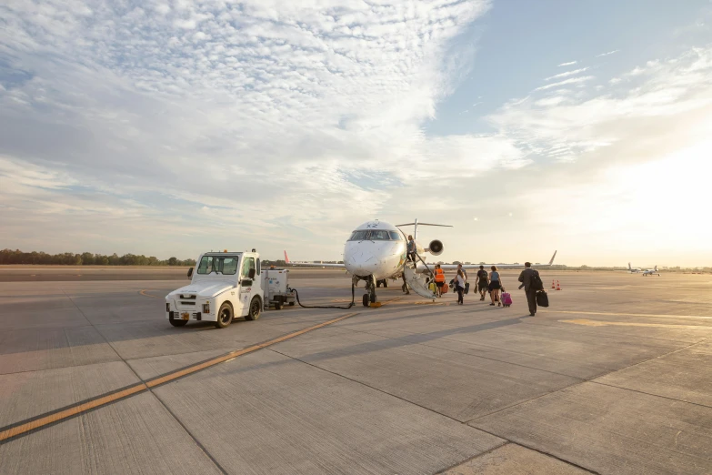 a large jetliner sitting on top of an airport tarmac, by Daniel Seghers, pexels contest winner, full morning sun, everyone having fun, new mexico, thumbnail