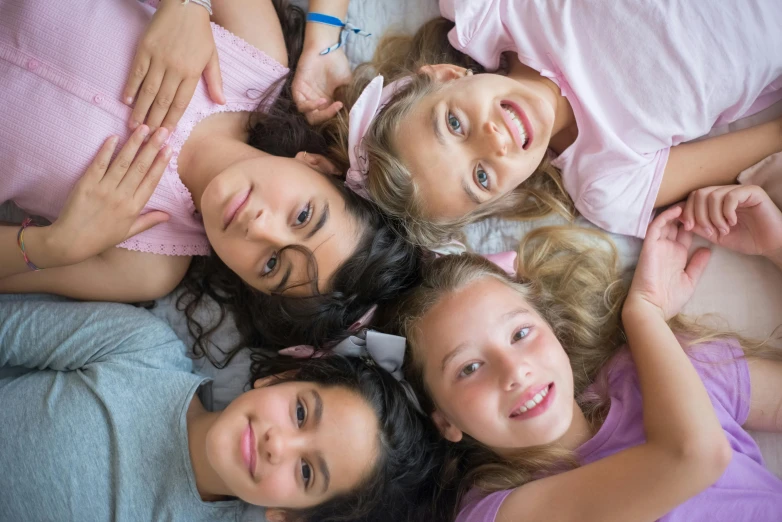 a group of girls laying on top of each other, by Alice Mason, pixabay, incoherents, wearing a pink head band, high angle closeup portrait, 15081959 21121991 01012000 4k, in the bedroom at a sleepover