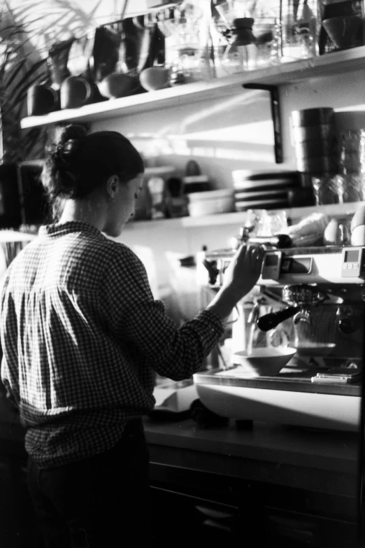 a black and white photo of a person in a kitchen, aussie baristas, medium format, mariko mori, :: morning