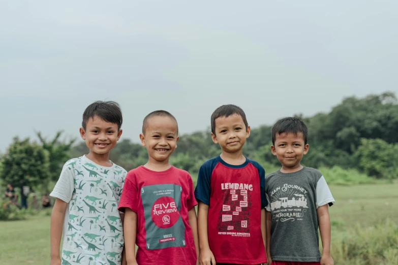 a group of children standing next to each other, a picture, pexels contest winner, batik, portrait image, handsome, high-resolution photo