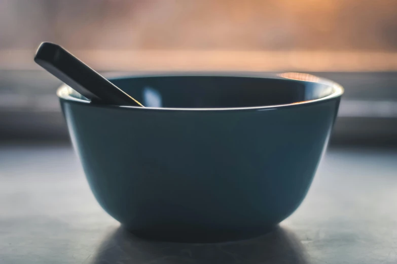 a blue bowl with a cell phone in it, trending on pexels, cutlery, bowl haircut, calm evening, grey