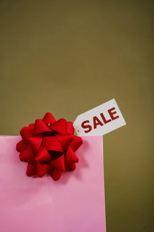 a pink gift bag with a sale tag on it, pexels, magic realism, square, paul barson, holiday, sap
