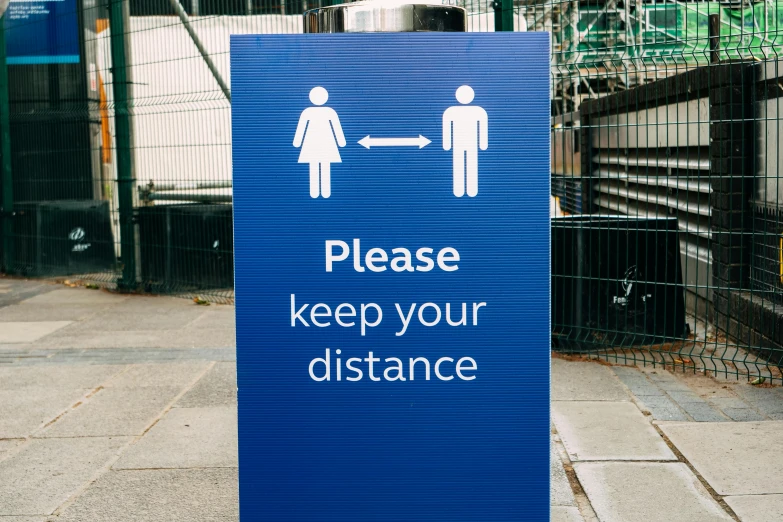 a blue sign that says please keep your distance, a poster, unsplash, male and female, square, healthcare, high quality photo