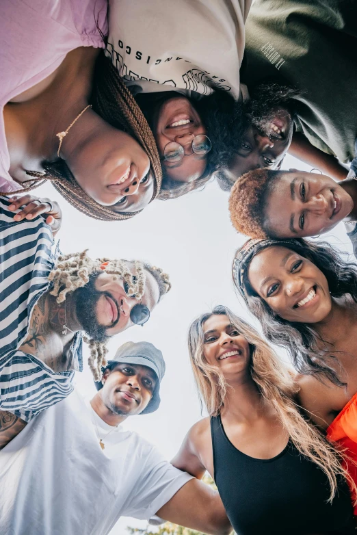 a group of young people standing in a circle, a picture, trending on pexels, black arts movement, rooftop party, head shot, tourist photo, upward shot