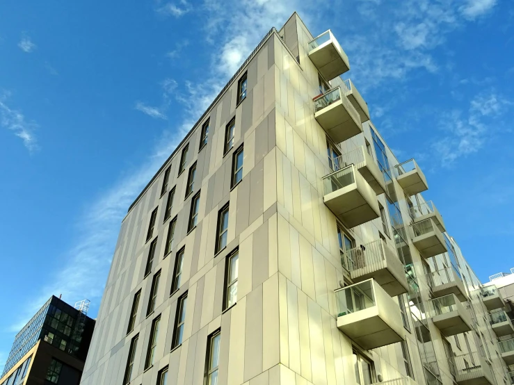 a tall building with balconies on the side of it, a photo, unsplash, bauhaus, vray renderer, white panels, london architecture, hyper photo realistic 8k hd hdri