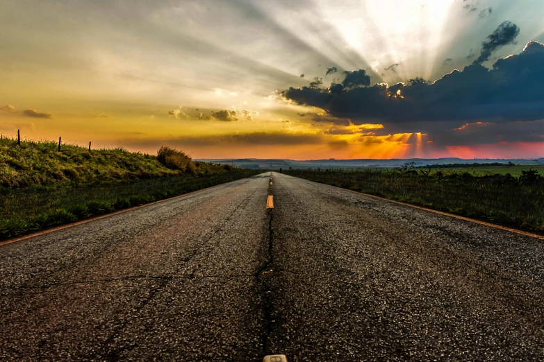 a road stretches into the distance as the sun sets, an album cover, unsplash, renaissance, hdr photography, profile picture 1024px, big sky, flattened