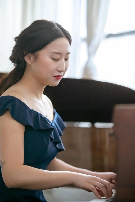 a woman in a blue dress playing a piano, an album cover, inspired by Ma Lin, unsplash, square, performance, beautiful south korean woman, medium detail