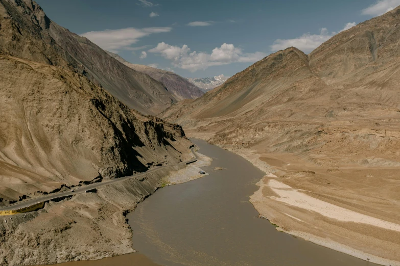 a train traveling down a mountain side next to a river, pexels contest winner, hurufiyya, erosion algorithm landscape, himalayas, still from a wes anderson movie, thumbnail