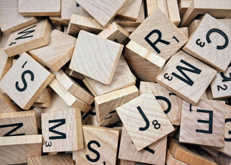 a pile of scrabbles sitting on top of each other, unsplash, letterism, square, a wooden, profile image
