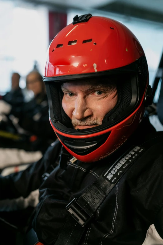 a close up of a person wearing a helmet, a portrait, gordon murray, having a great time, in flight suit, thumbnail