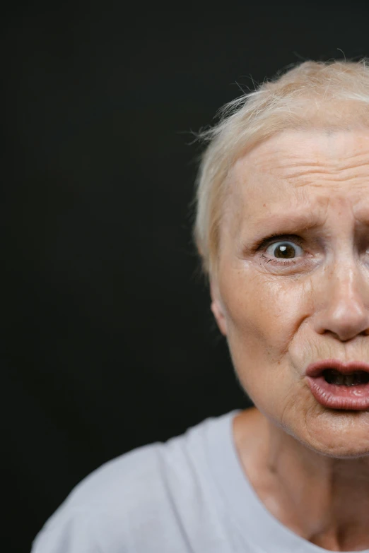 a woman with a surprised look on her face, trending on reddit, aging, non-binary, intense screaming expression, trending photo